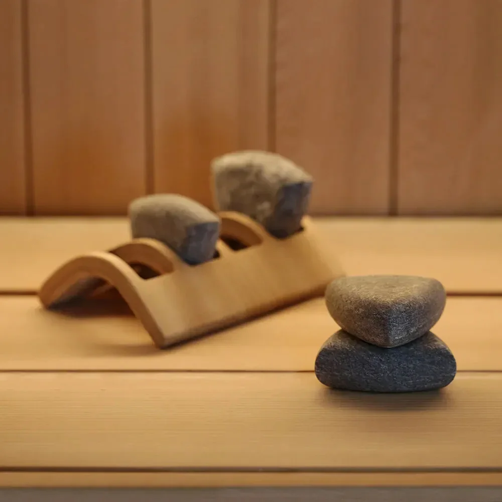 SAWO spa stones arranged on a wooden rack