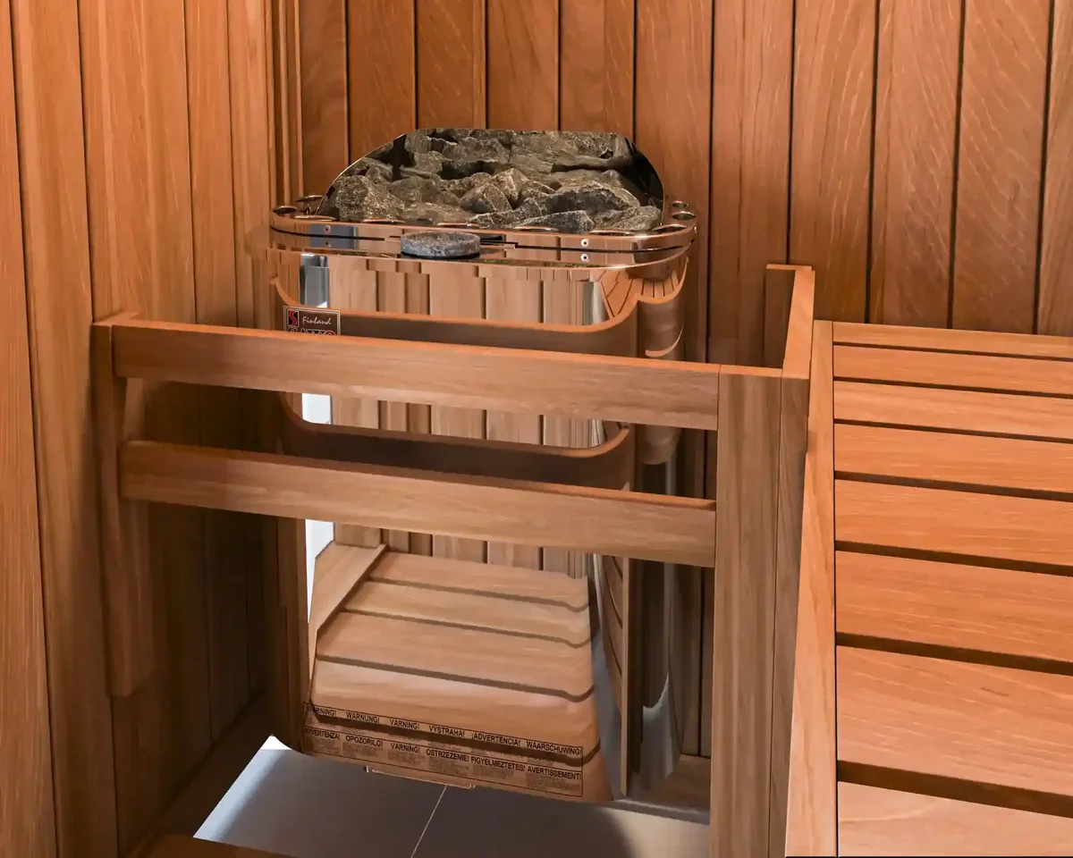 Stainless SAWO Scandia heater with its stone tray, set inside a wooden bench surround
