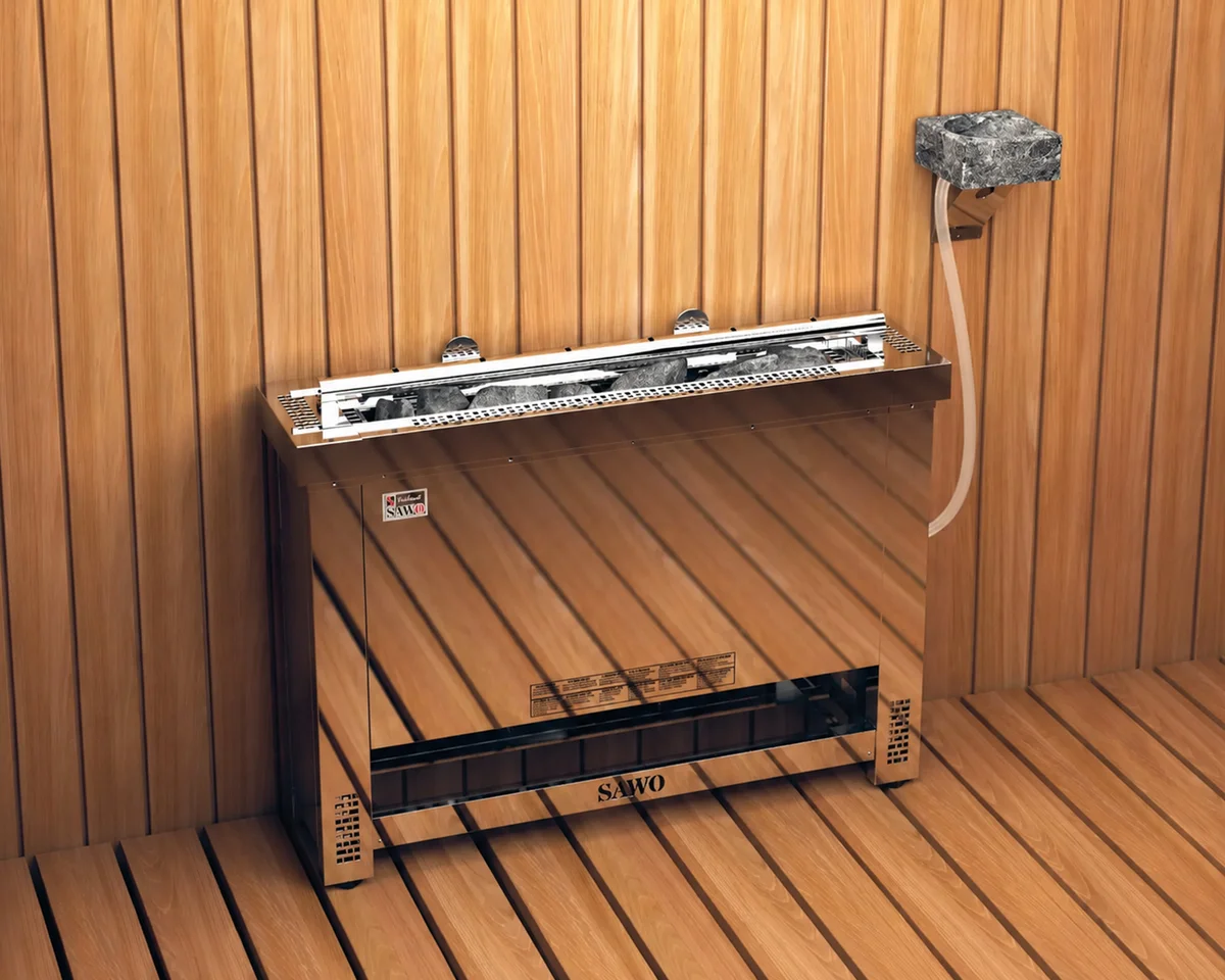 SAWO Helius heater unit against a cedar wall, with its wall-mounted stone water basin and feed tube