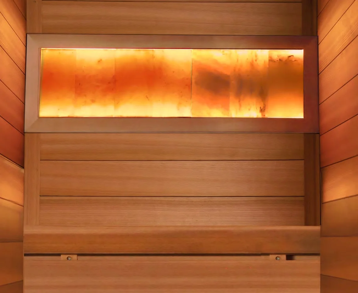 Lit Himalayan salt light wall panel set into a cedar sauna wall