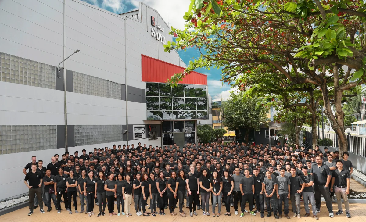 SAWO's staff gathered outside the company's manufacturing site